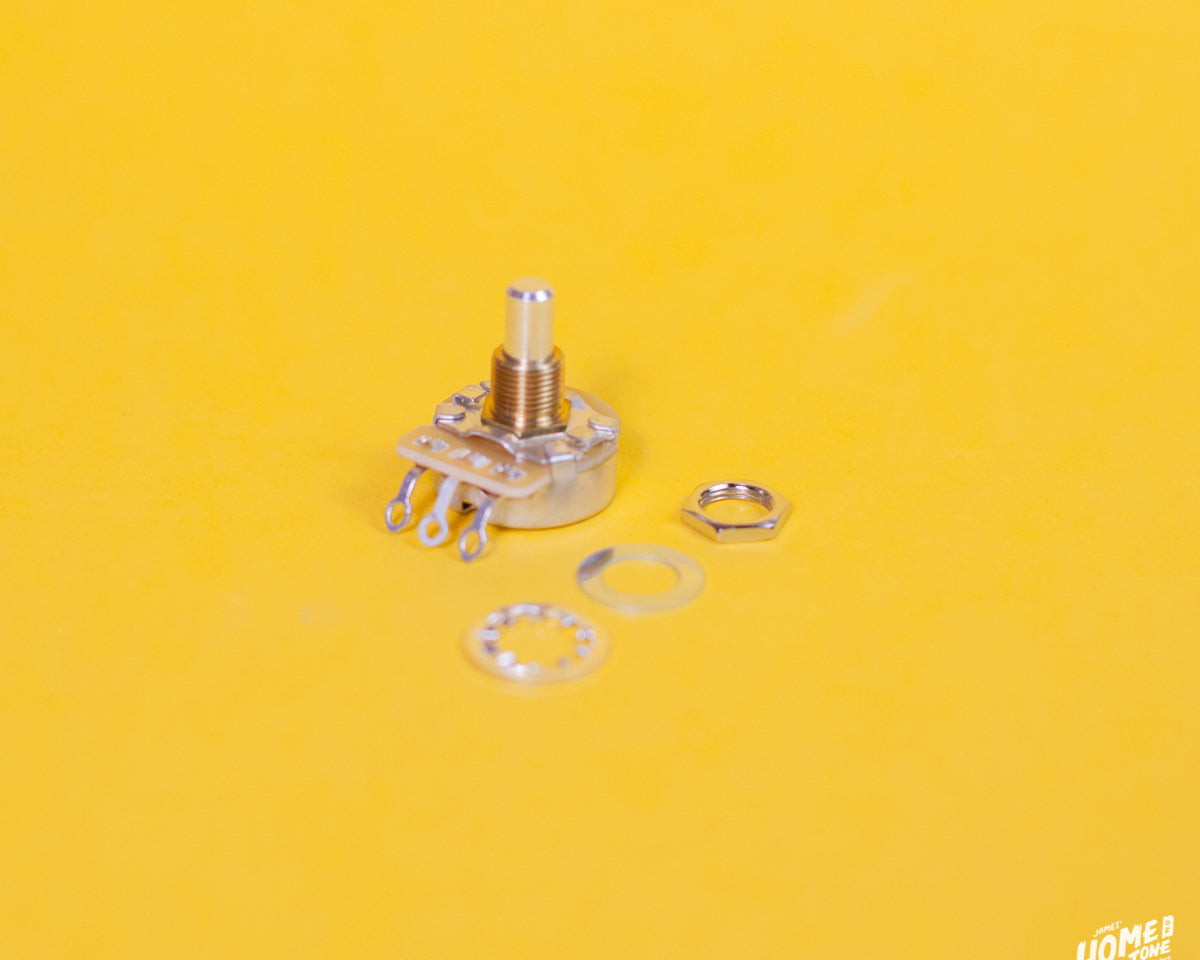Mechanical potentiometer with washers on a yellow background