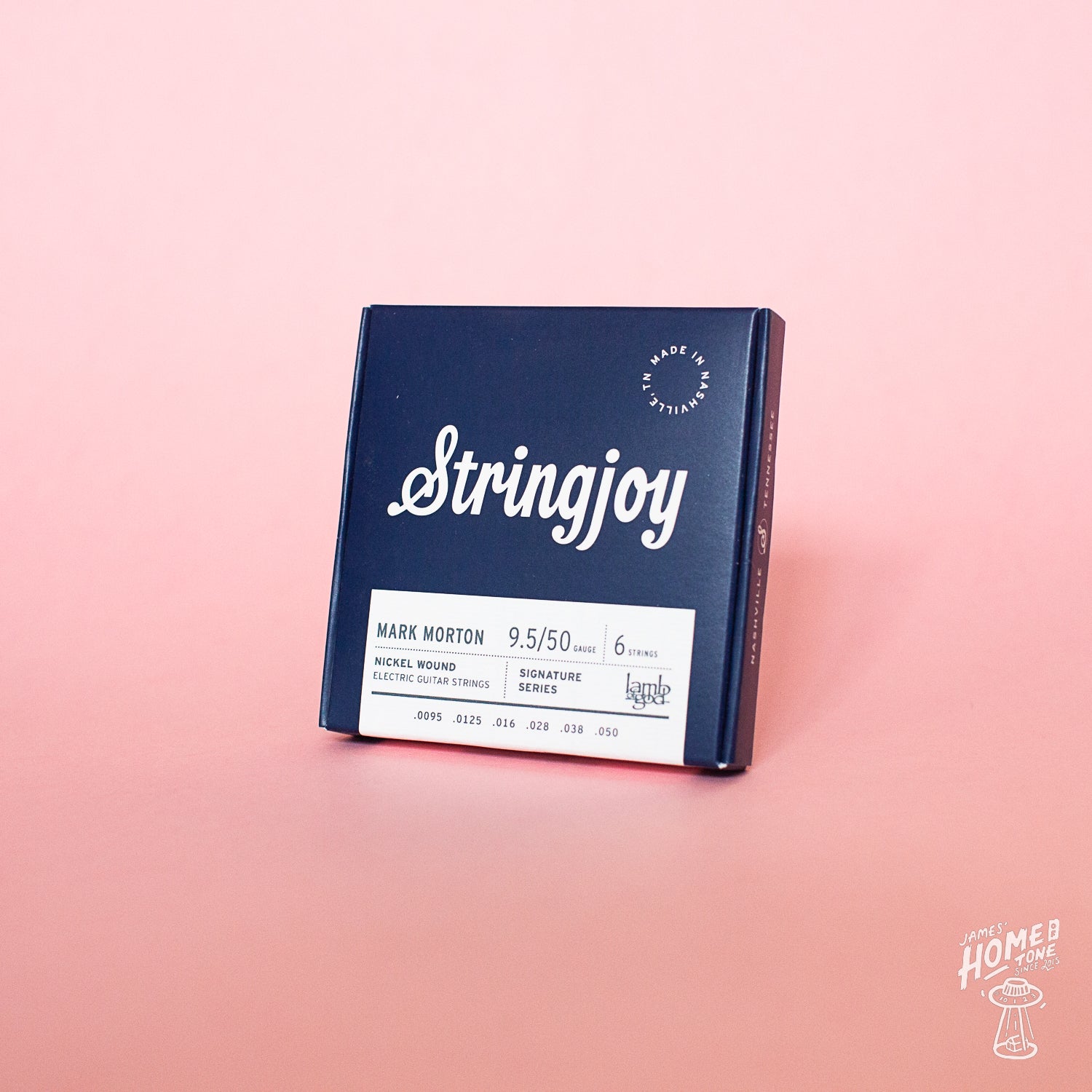 Stringjoy guitar string box on a pink and purple gradient background