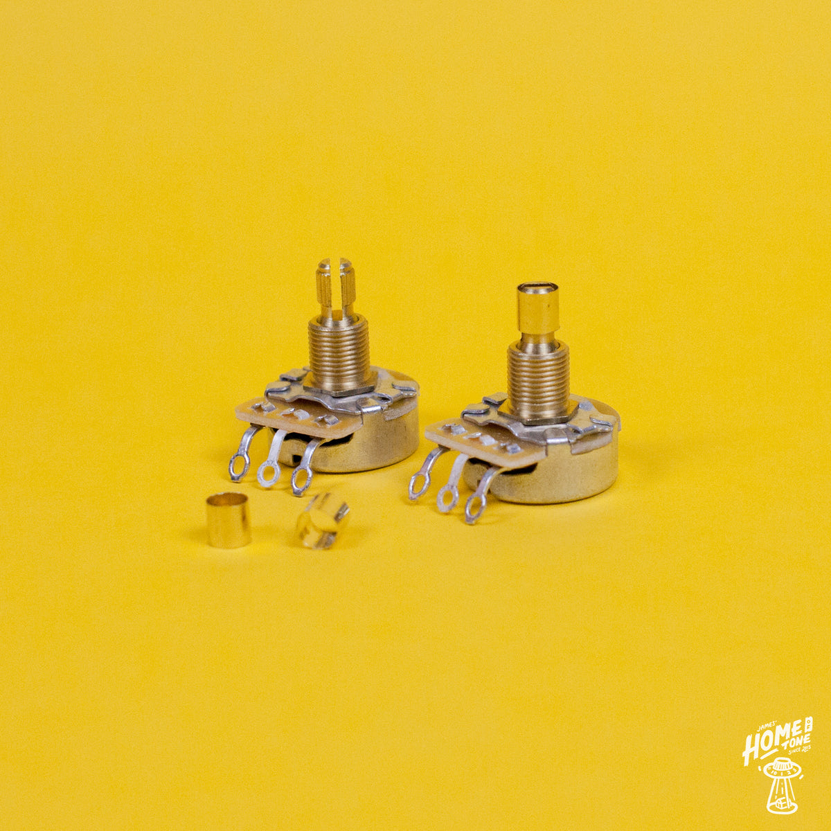 Two brass pot sleeves designed to convert split shaft pots to solid shaft pots, displayed on a yellow background.
