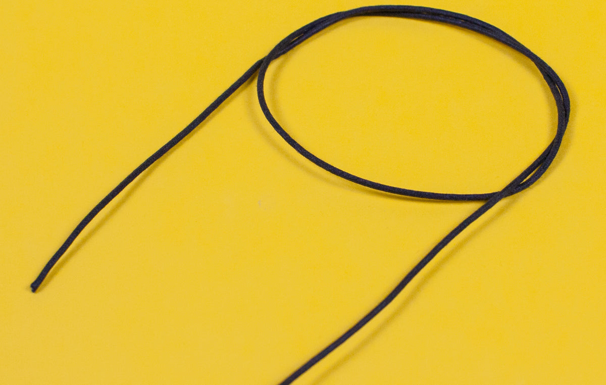 A reel of Gavitt USA 22awg cloth covered wire in black
