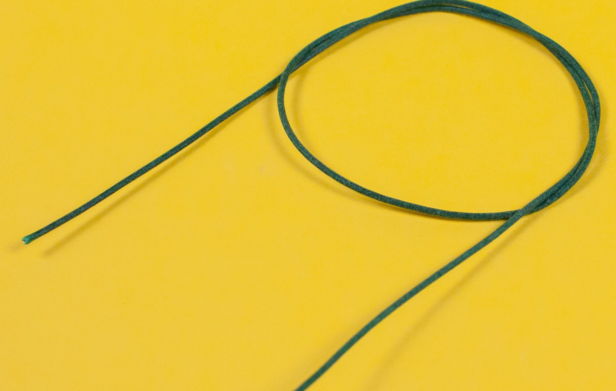 A reel of Gavitt USA 22awg cloth covered wire in green