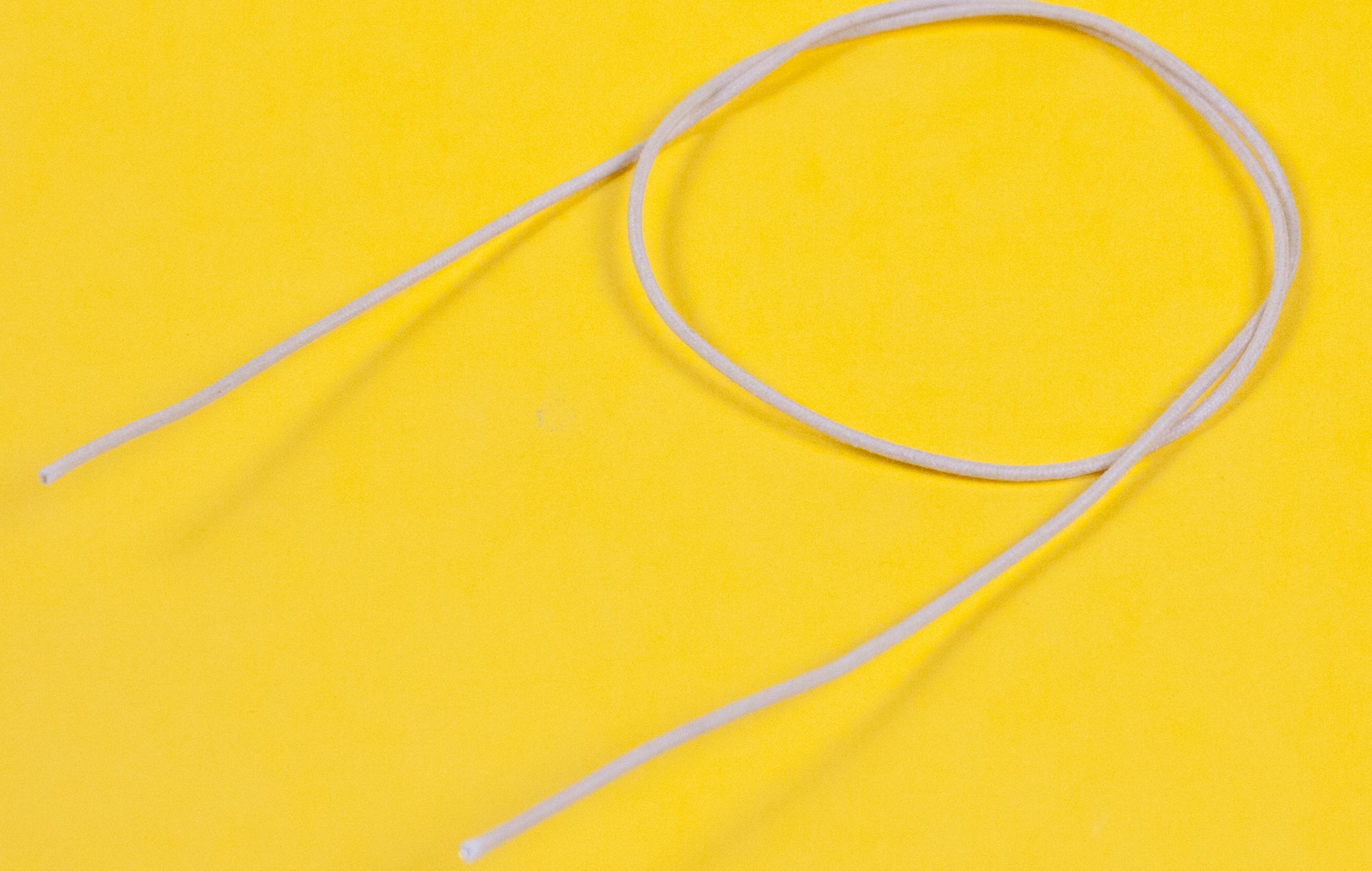 A reel of Gavitt USA 22awg cloth covered wire in off white