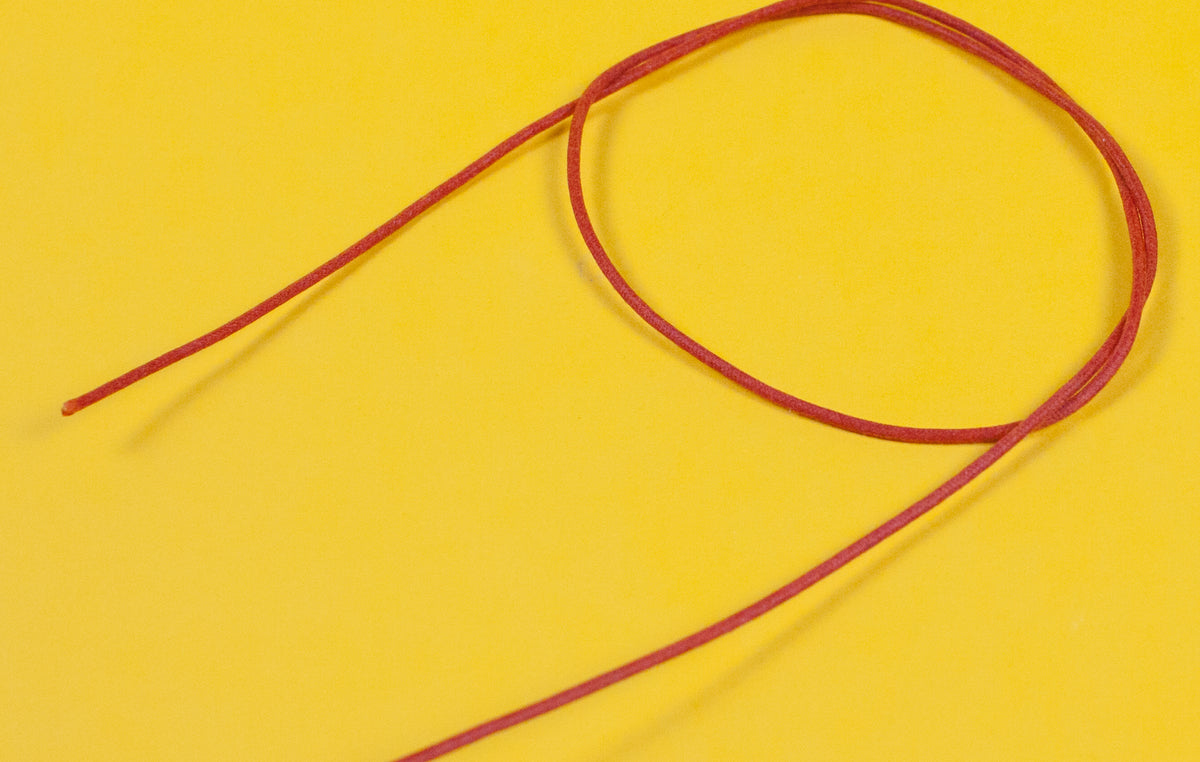 A reel of Gavitt USA 22awg cloth covered wire in orange