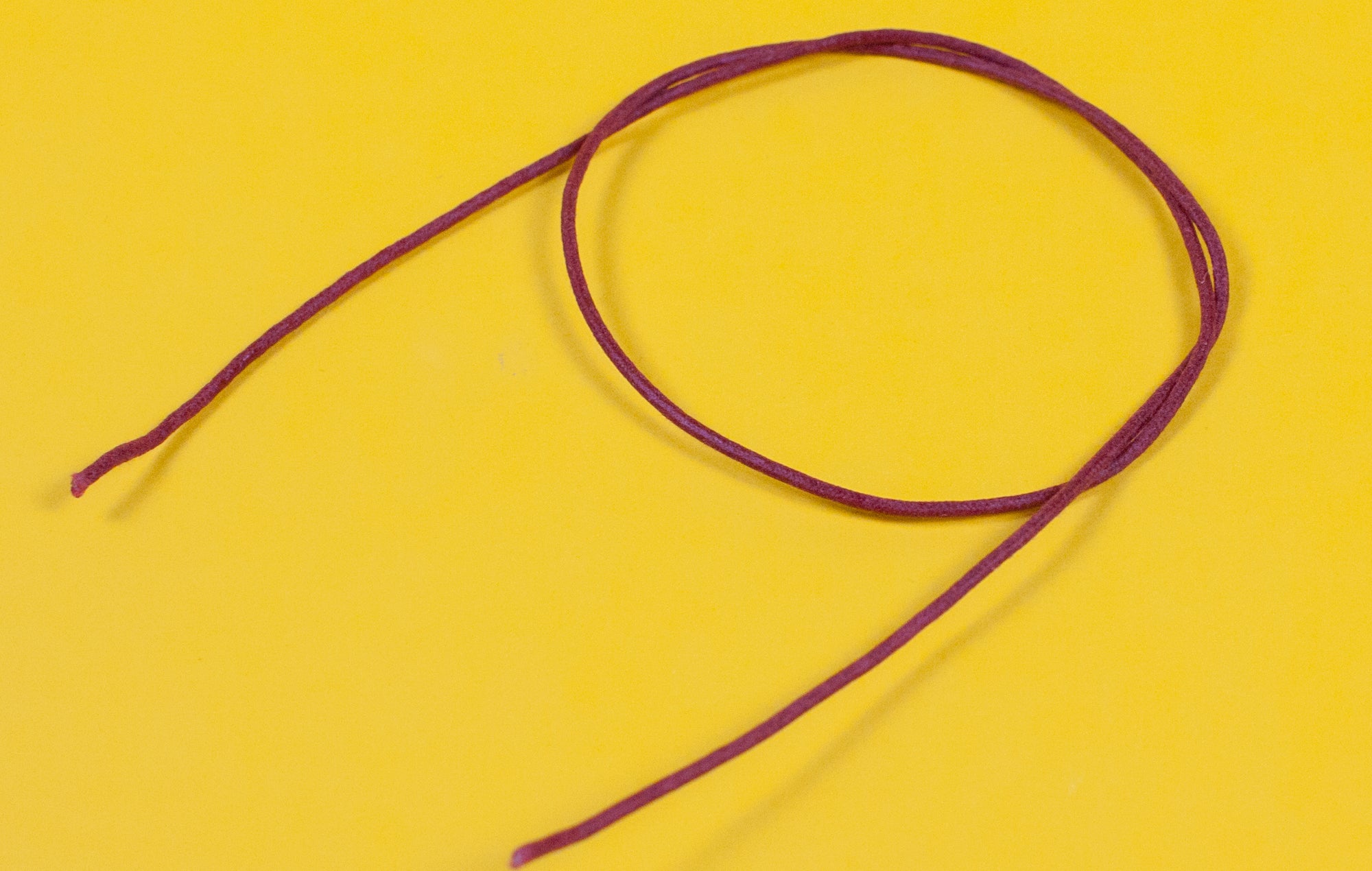 A reel of Gavitt USA 22awg cloth covered wire in red