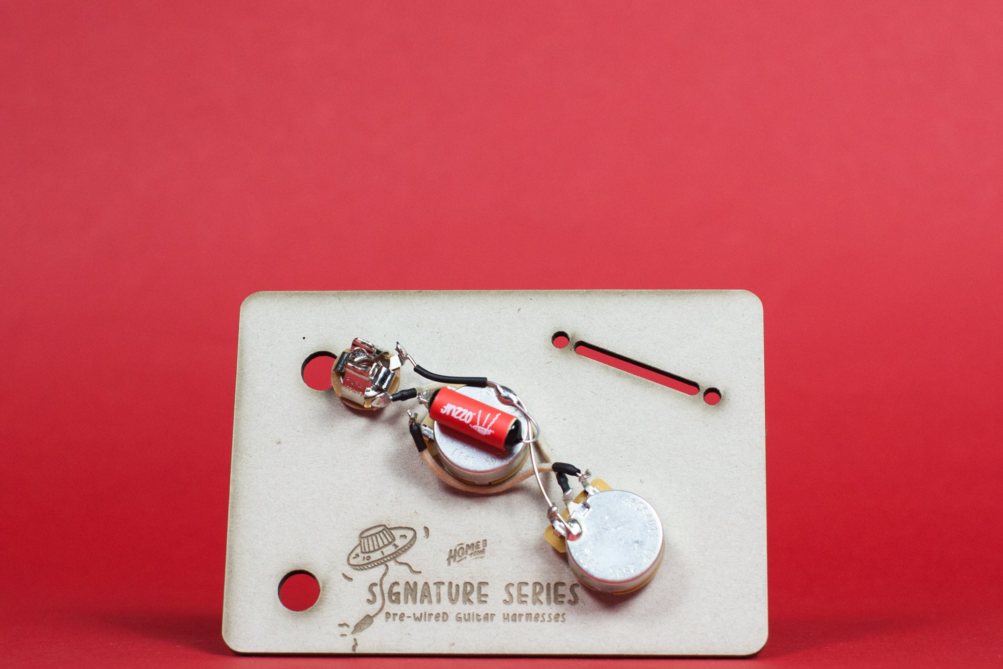 Photograph of a pre-wired bass guitar wiring loom, made for Fender Musicmaster Bass models.