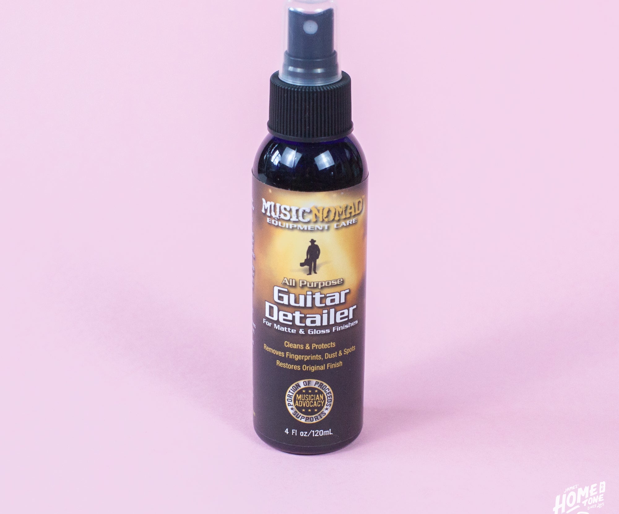 A spray bottle of MusicNomad Guitar Detailer for cleaning and maintaining matte and gloss finished guitars.