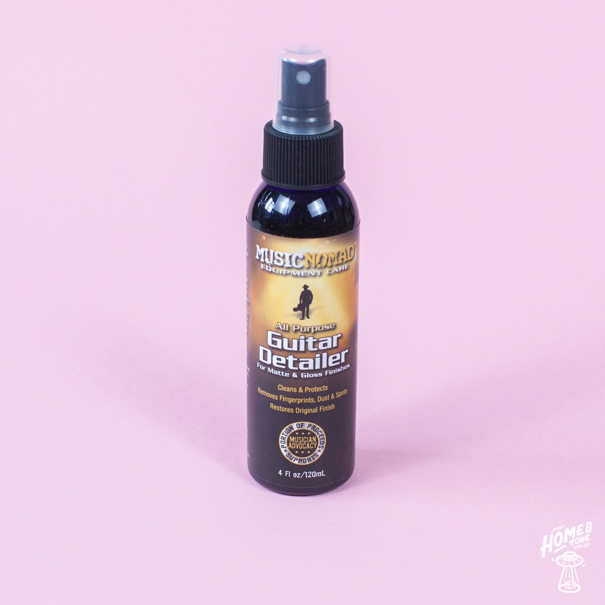 A spray bottle of MusicNomad Guitar Detailer for cleaning and maintaining matte and gloss finished guitars.