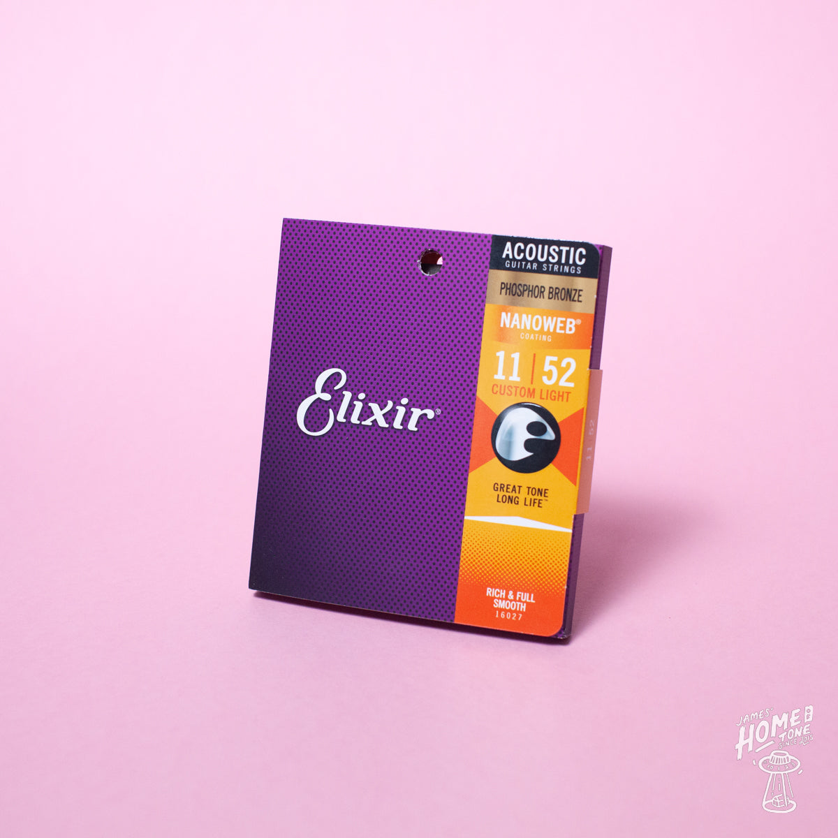 A pack of Elixir Nanoweb coated phosphor bronze acoustic guitar strings with gauges 11-52 displayed against a pink background.