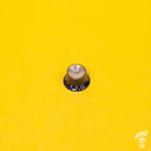 Gibson style black and gold tone reflector cap control knob