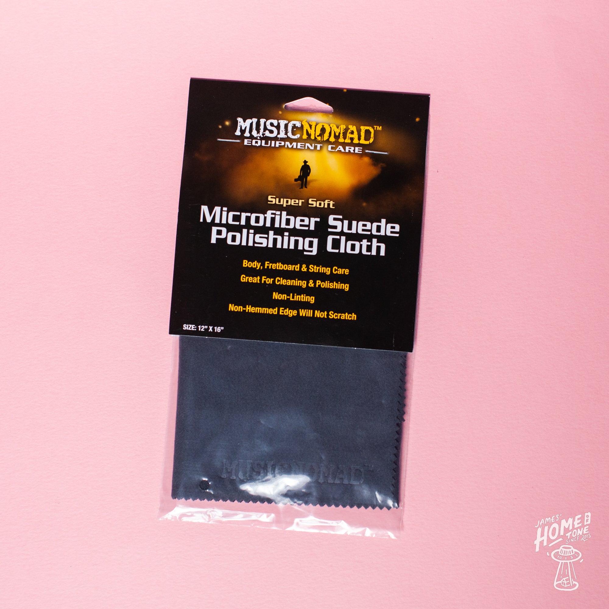 Packaged Microfiber Suede Polishing Cloth by MusicNomad on a pink background.