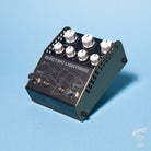A Thorpy FX Electric Lightning tube drive pedal with multiple knobs and switches for controlling tone, volume, and effects, placed on a blue background.