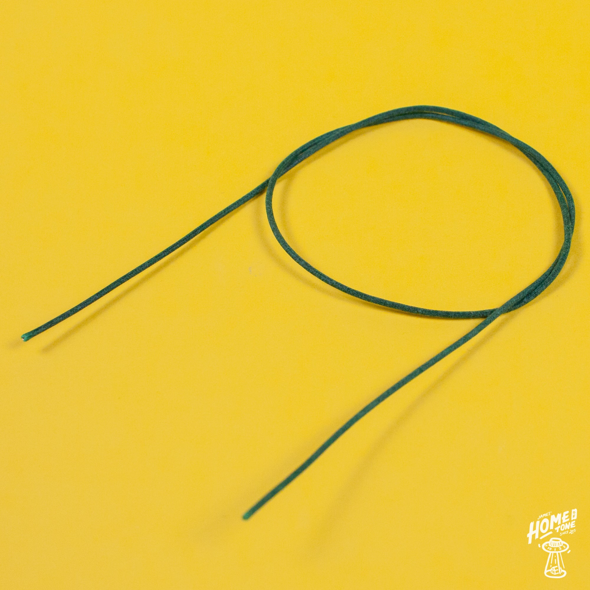 A reel of Gavitt USA 22awg cloth covered wire in green