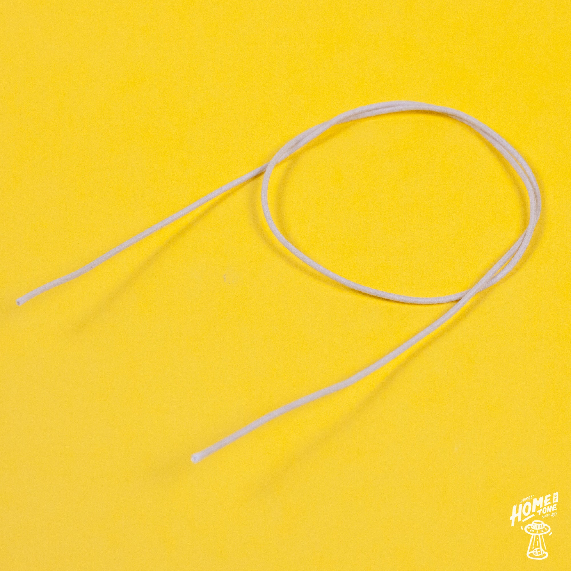 A reel of Gavitt USA 22awg cloth covered wire in off white
