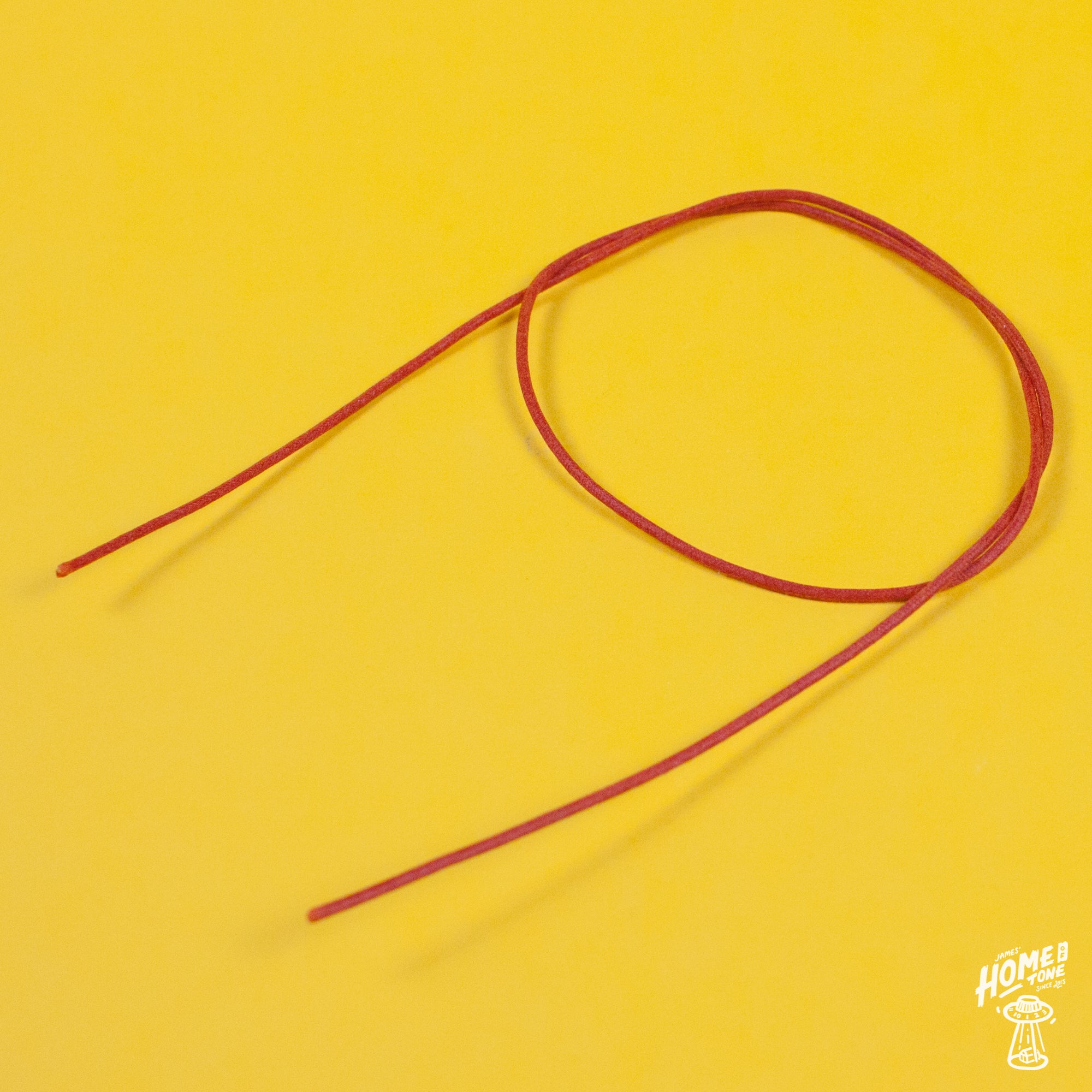 A reel of Gavitt USA 22awg cloth covered wire in orange
