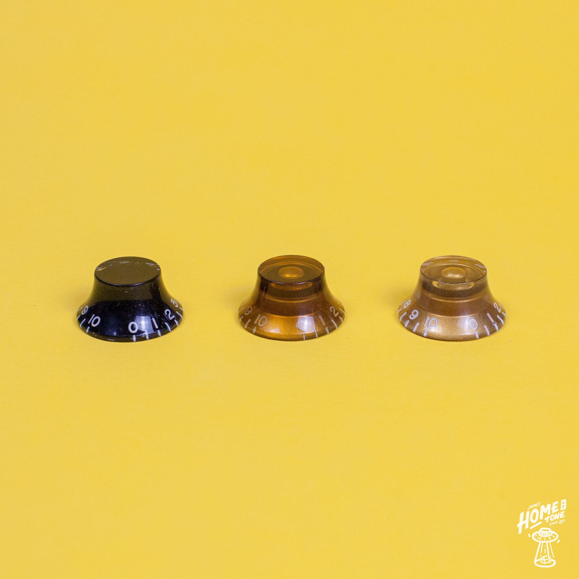 Gibson bell style control knobs in gold black and amber