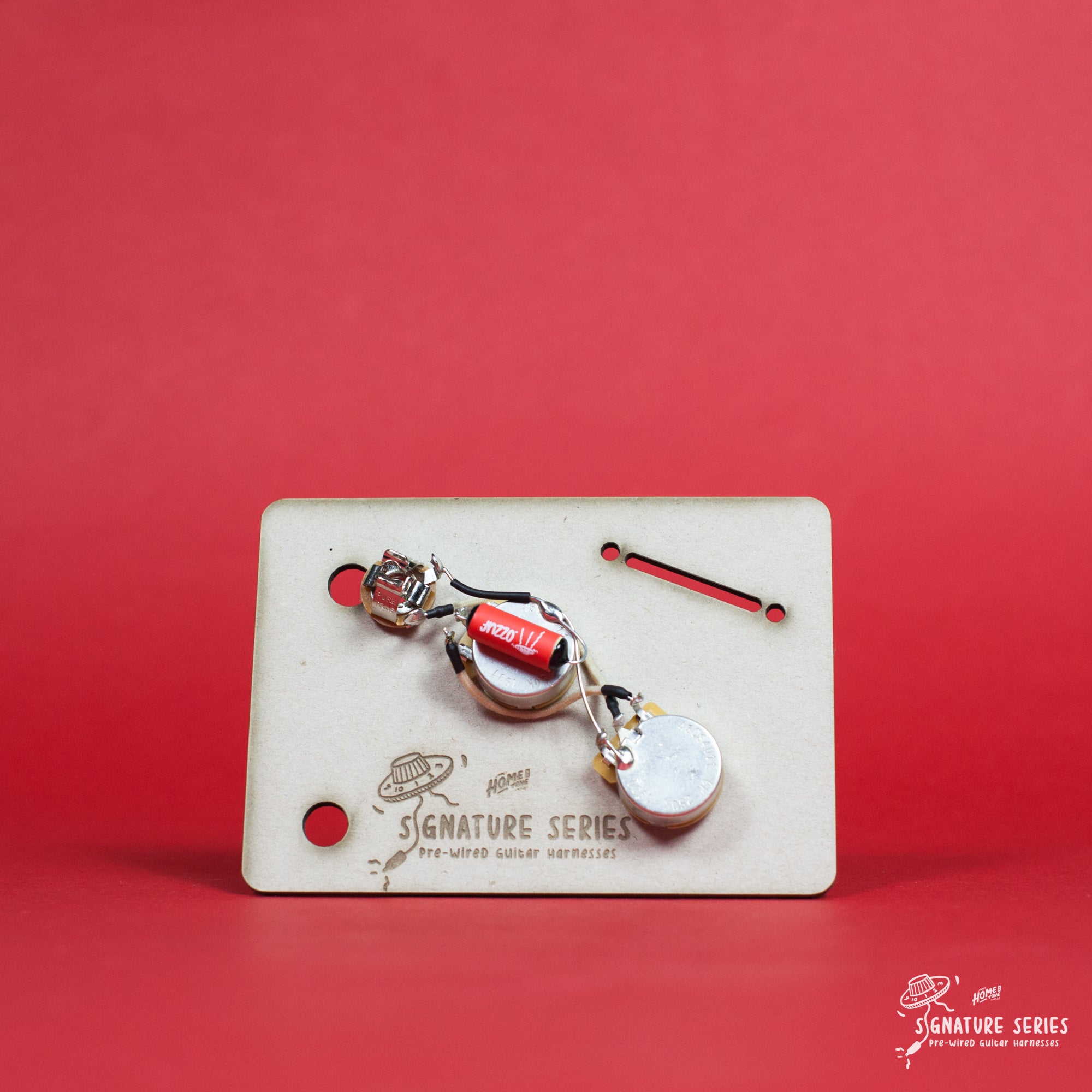 Photograph of a pre-wired bass guitar wiring loom, made for Fender Musicmaster Bass models.