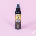 A spray bottle of MusicNomad Guitar Detailer for cleaning and maintaining matte and gloss finished guitars.