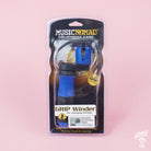 Packaged MusicNomad GRIP Winder with a blue handle, displayed in its clear plastic packaging, against a pink background.