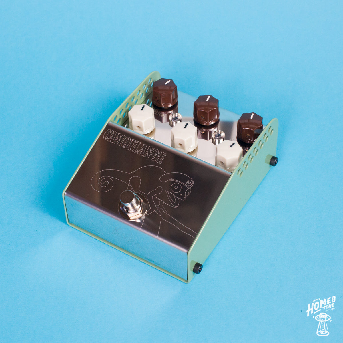 A stainless steel ThorpyFX Camoflange Flanger effect pedal with a green powder coat base, featuring knobs for Depth, Rate, Treble, Manual, Blend, and Harmonics, and an etched 'CAMOFLANGE' logo.