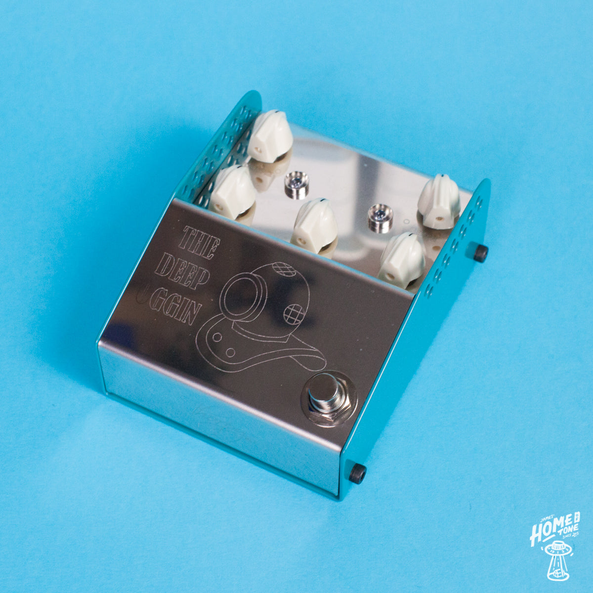 A stainless steel chorus/vibrato pedal with knobs for depth, rate, blend, volume, and treble, wrapped in an ocean blue powder coat base. The pedal is labeled 'THE DEEP OGGIN'.